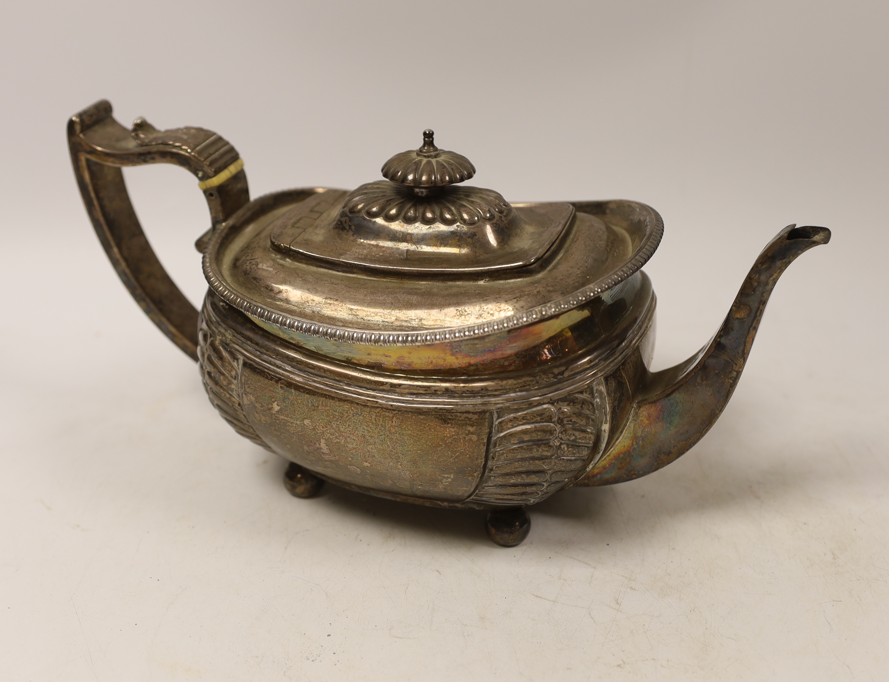 A George III silver shaped oval teapot, Charles Fox, London, 1815, with ivory CITES submission reference 9QAQRA42, gross weight 19.9oz.
